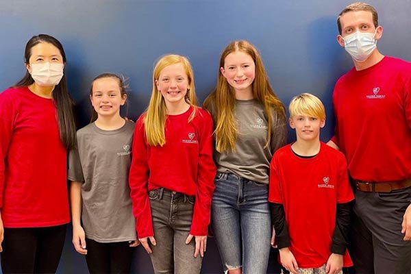 Dr. Lee and Dr. Neill with their patients at Raleigh Family Orthodontics  at Raleigh Family Orthodontics 