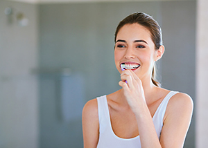 A woman practicing good oral hygiene