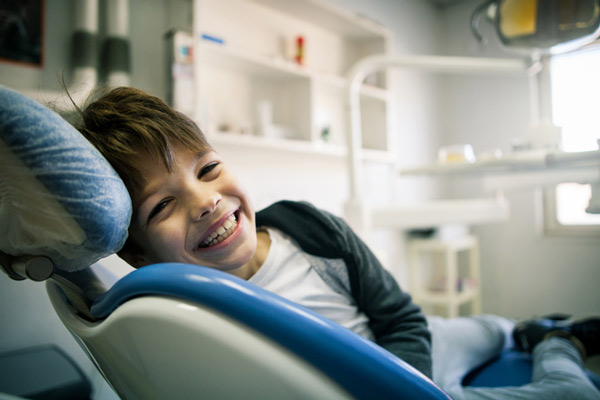 Young boy in dental chair for first orthodontic visit