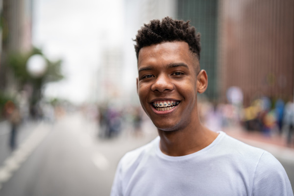 Teenage boy smiling with braces